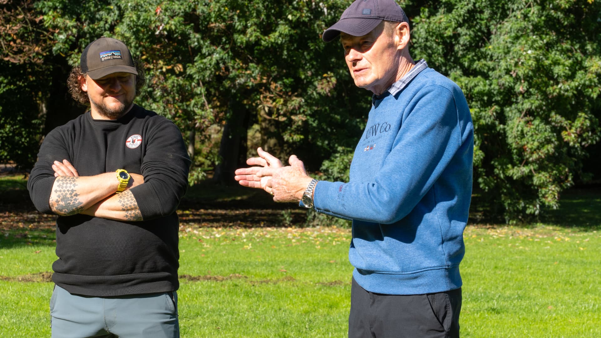 A coach speaking with a member in the park